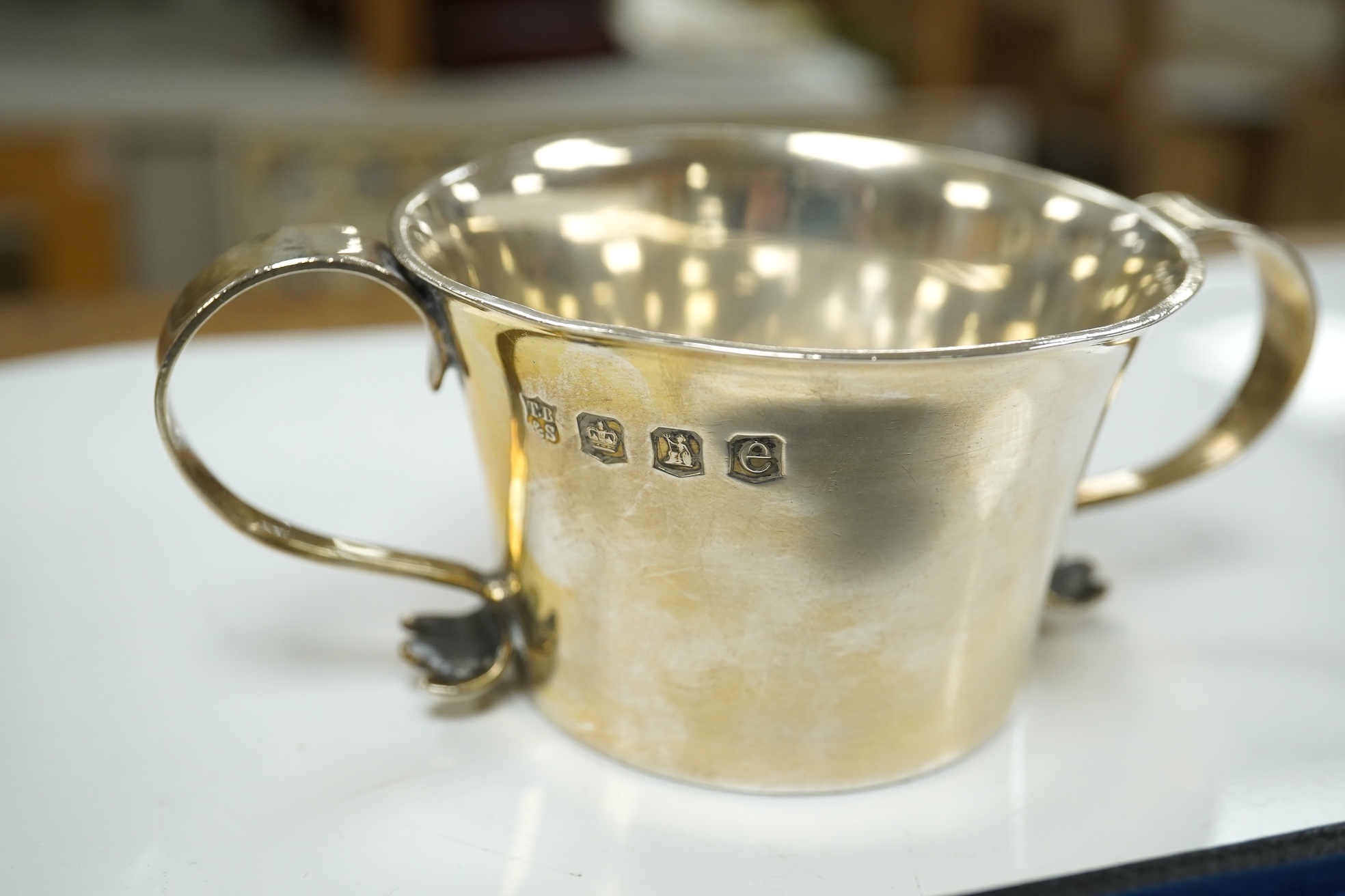 A George V Brittania standard silver two handled cup, Thomas Bradbury & Sons, Sheffield, 1922, height 49mm, two associated sections of a travelling watch case, with an Elkington nickel cased pocket watch, an Edwardian en